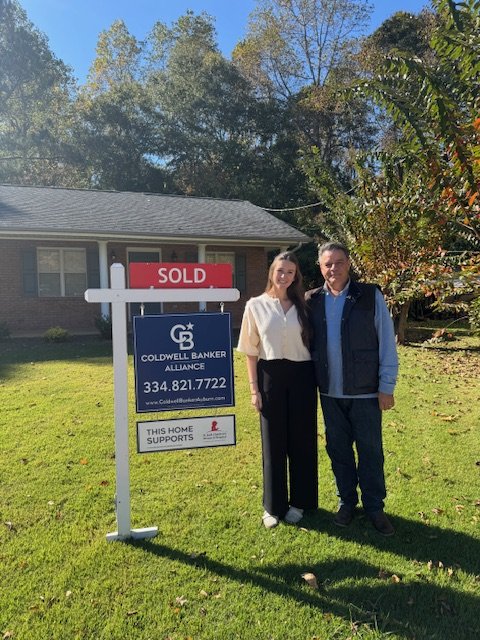 Barry and Brenna Oxley at a sold listing